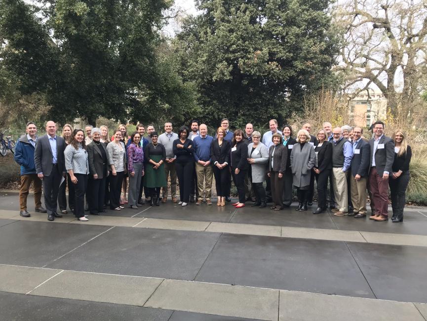 a group of stewardship practitioners stands for a group photo