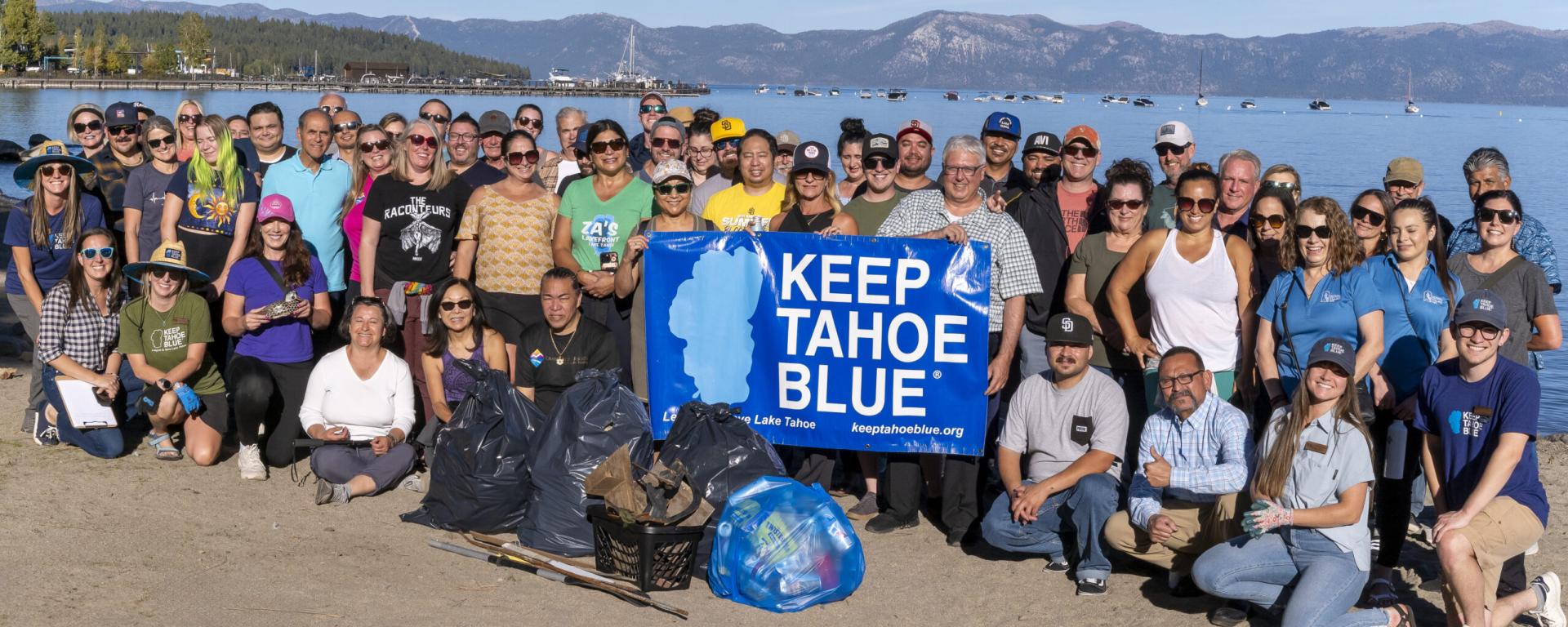 A group gathered at the beach by Lake Tahoe